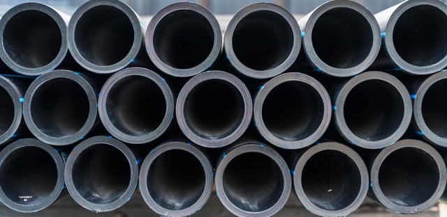 Pipes stacked in yard Galloway Ft Myers July 2025-5747 Large